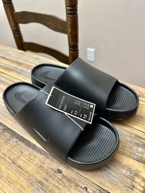 NWT Nike Men’s Black Nike Calm Slides Sandals Size Men’s 11 Women’s 12